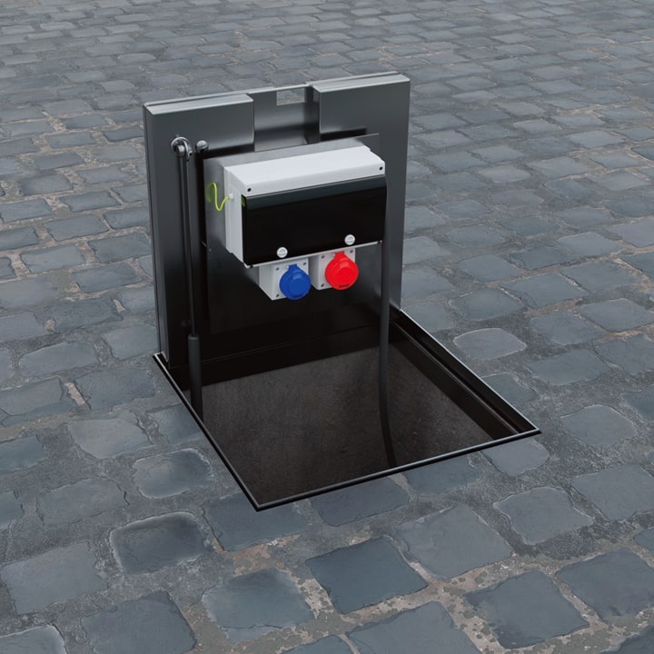 Pop Up Power SuppImage of an in-ground unt with the hinged lid closed